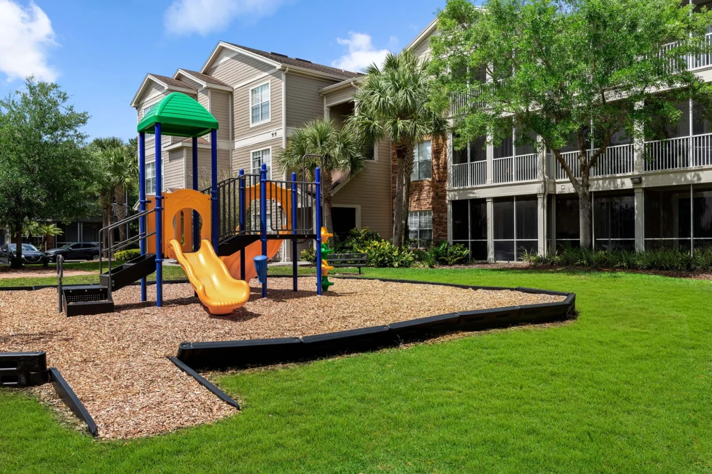Playset outside apartments.